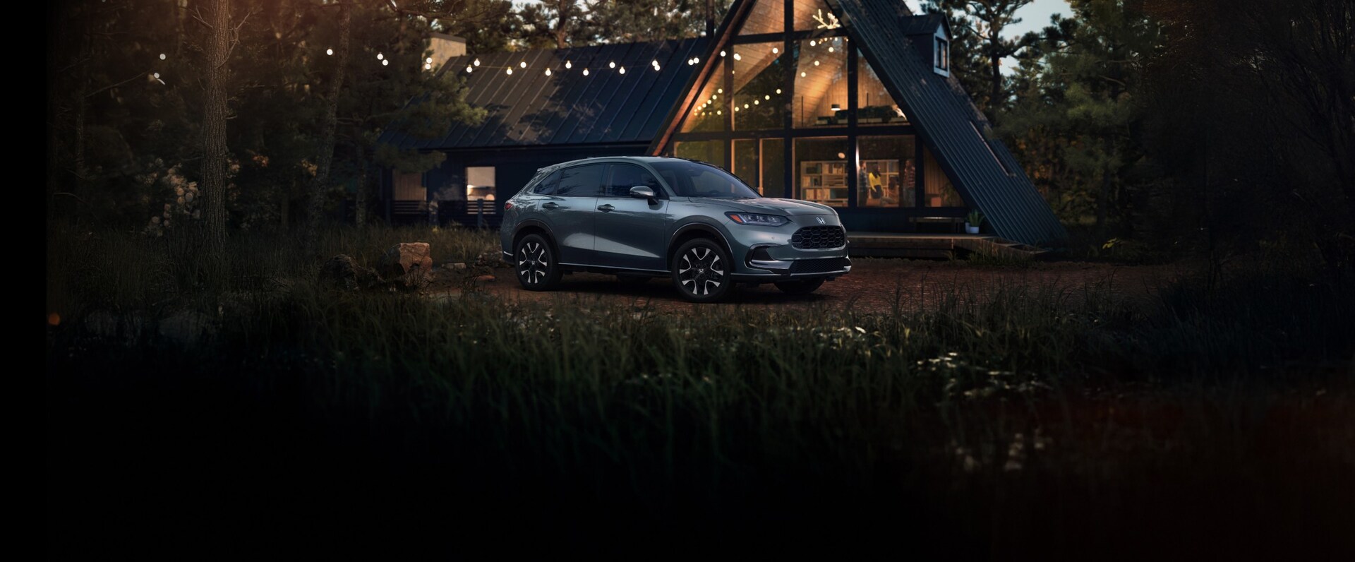2026 HR-V In Nordic Forest Pearl parked in front of a wood house