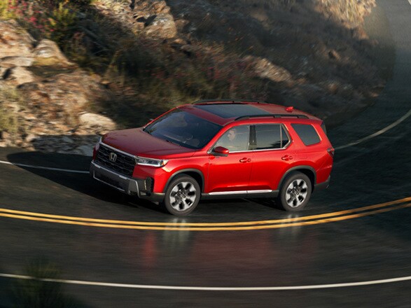 2026 Honda Pilot Elite shown in Radiant Red Metallic II.