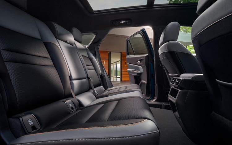 2026 Honda Prologue Elite interior, with gray leather seats viewed from the side.